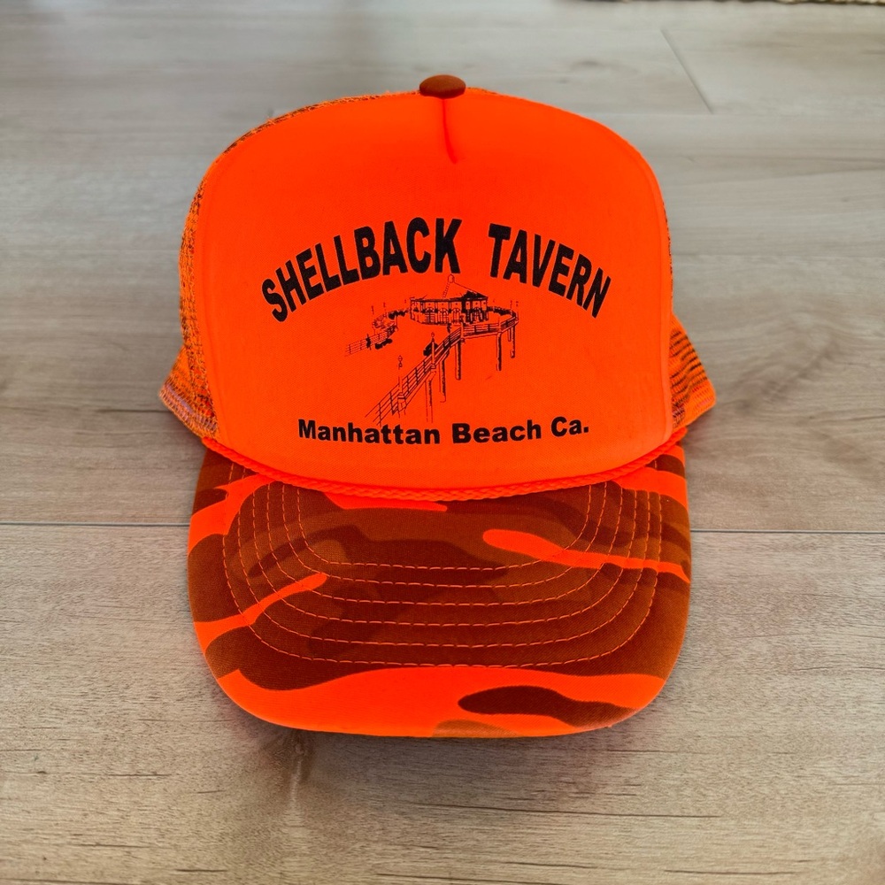 Famed “Shellback Tavern” orange camo trucker hat